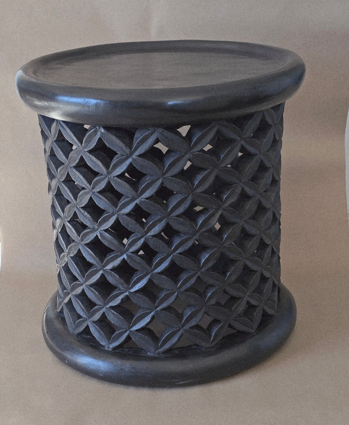 Hand crafted from a tree trunk and hand carved/bamileke stools/ 24 inches